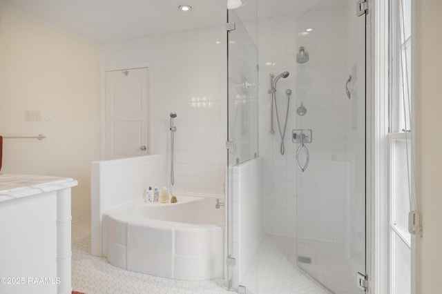 full bath with a stall shower, tile patterned flooring, a bath, and vanity