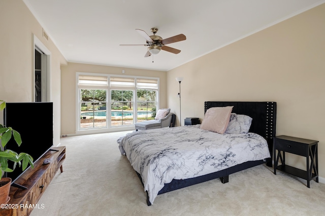 bedroom featuring light carpet, visible vents, a ceiling fan, and crown molding