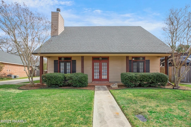 bungalow with french doors, central AC, and a front yard