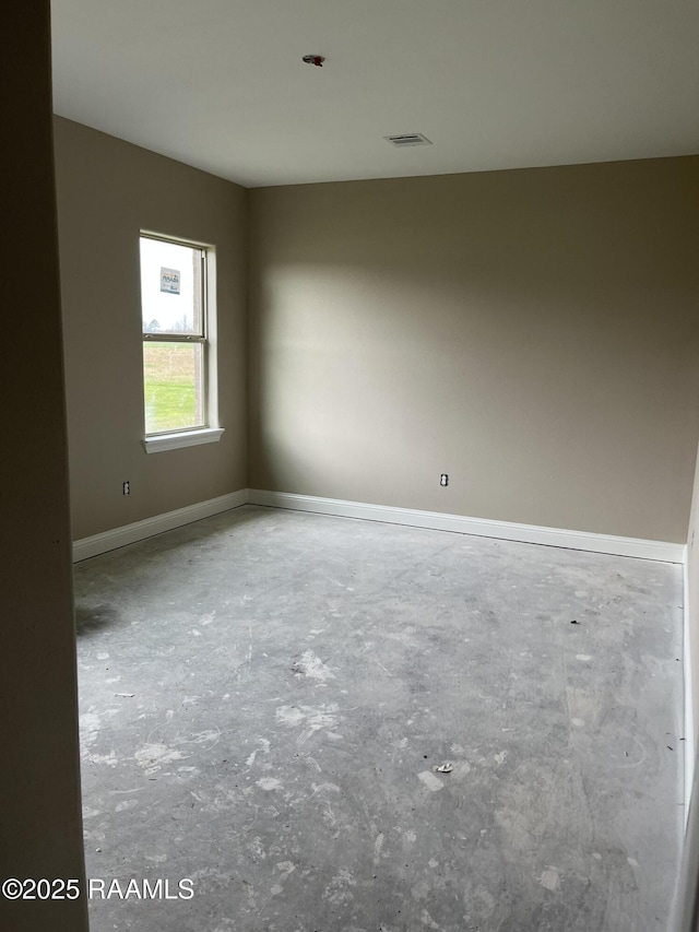 spare room with concrete flooring