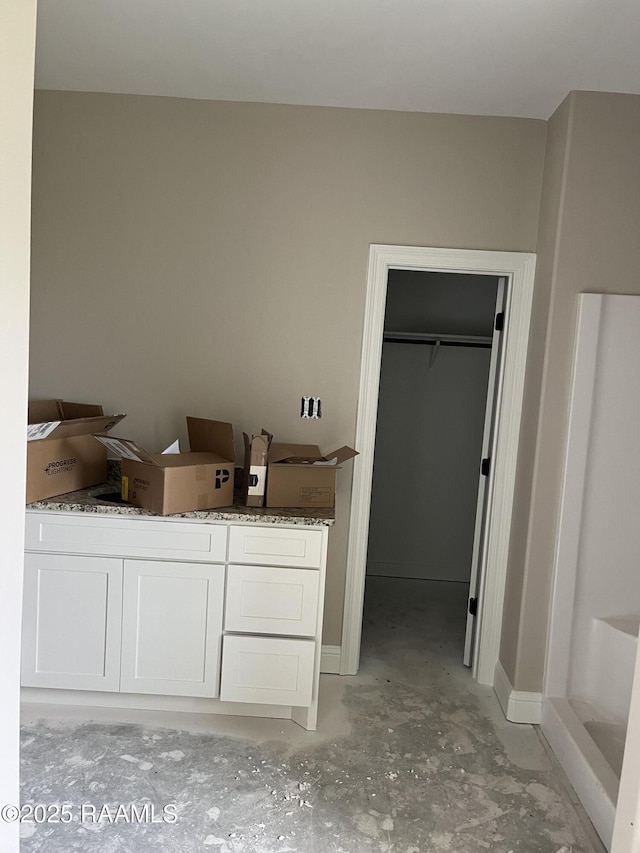 bathroom featuring concrete floors