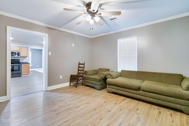 living area with baseboards, visible vents, a ceiling fan, ornamental molding, and light wood-style floors