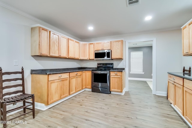 kitchen featuring stainless steel appliances, dark countertops, light brown cabinets, and visible vents