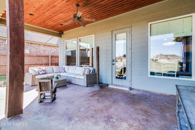 view of patio / terrace featuring an outdoor hangout area, fence, and a ceiling fan