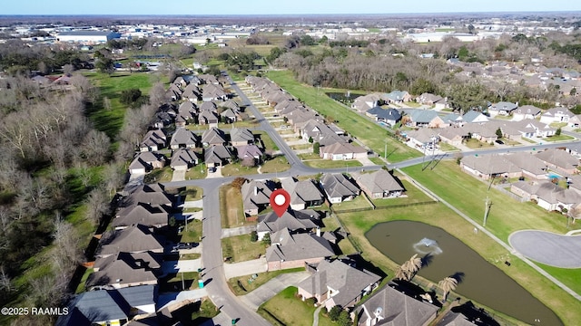 birds eye view of property with a residential view and a water view