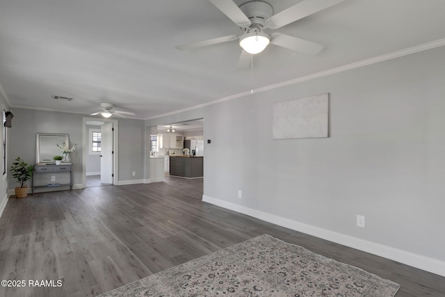 unfurnished living room featuring dark wood-style floors, visible vents, and crown molding