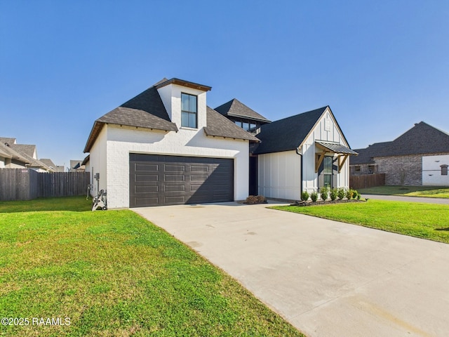 view of front of house featuring an attached garage, concrete driveway, a front yard, and fence