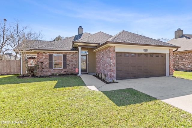 ranch-style house featuring a garage and a front yard