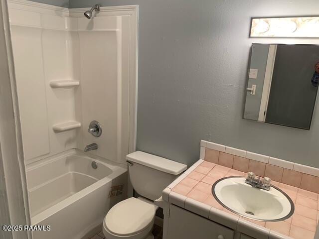 full bathroom with vanity, tub / shower combination, and toilet