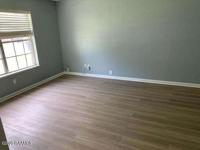 unfurnished room featuring hardwood / wood-style floors