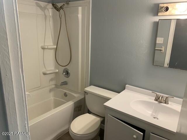 full bathroom with toilet, vanity, and tub / shower combination