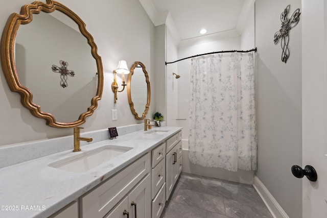 bathroom featuring double vanity, shower / bath combo with shower curtain, a sink, and recessed lighting