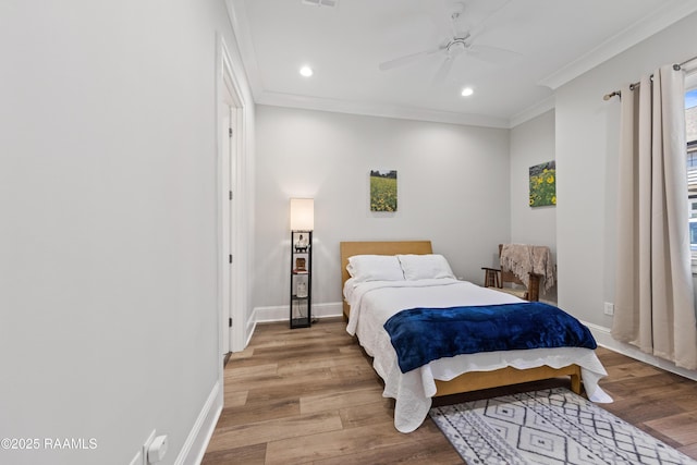 bedroom featuring light wood-style floors, recessed lighting, ornamental molding, and baseboards