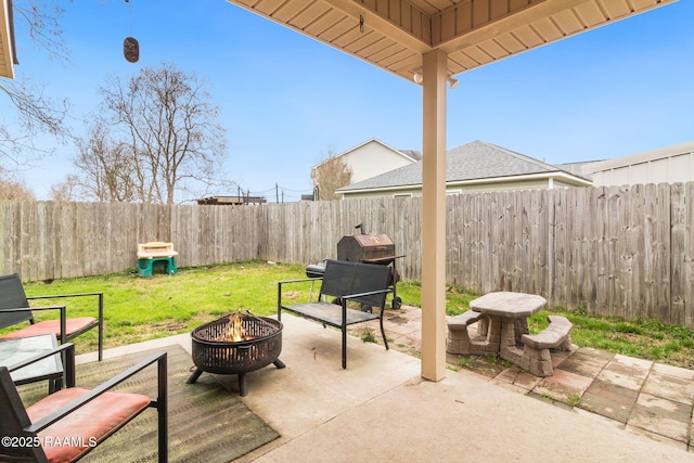 view of patio with an outdoor fire pit and a fenced backyard