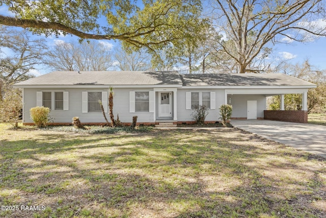 ranch-style house featuring a carport, concrete driveway, and a front yard