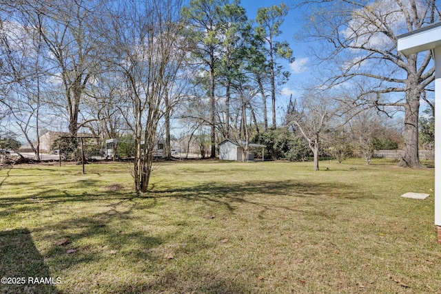 view of yard with a storage shed and an outdoor structure