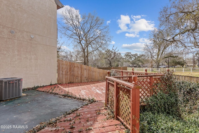 view of yard with cooling unit, a patio area, and a fenced backyard