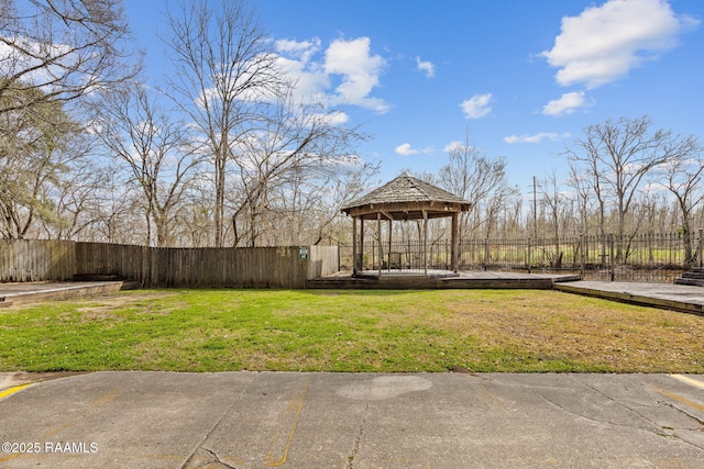 view of yard featuring a gazebo and fence