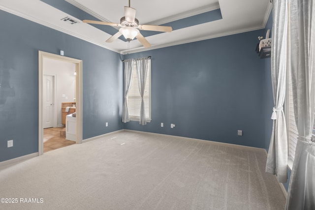 unfurnished bedroom with light carpet, ornamental molding, visible vents, and baseboards