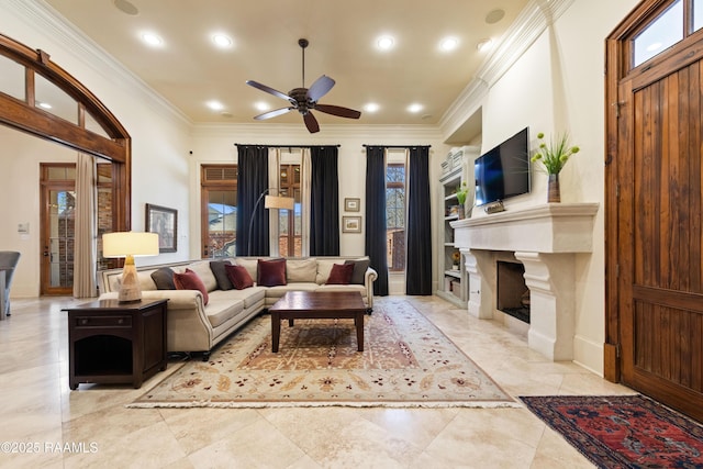 living area featuring a fireplace with flush hearth, a ceiling fan, crown molding, and recessed lighting