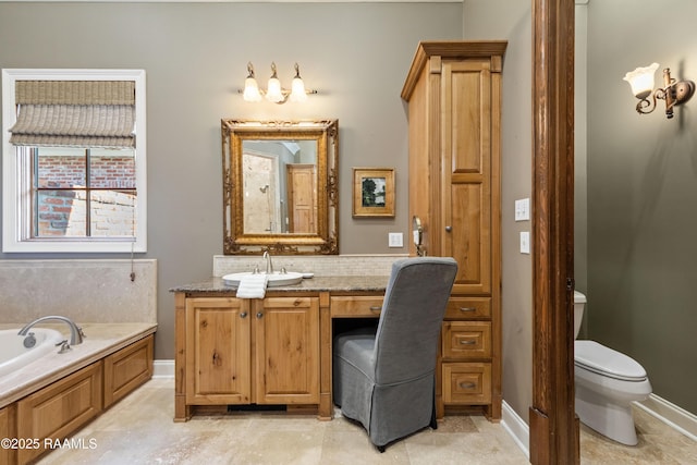 bathroom with baseboards, decorative backsplash, toilet, vanity, and a bath