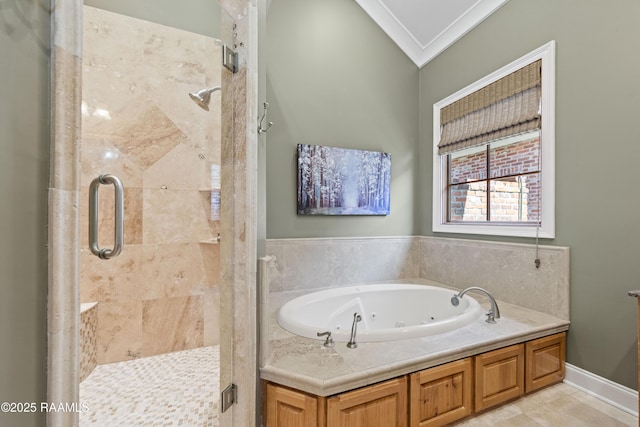 bathroom with a stall shower, tile patterned floors, a tub with jets, and ornamental molding