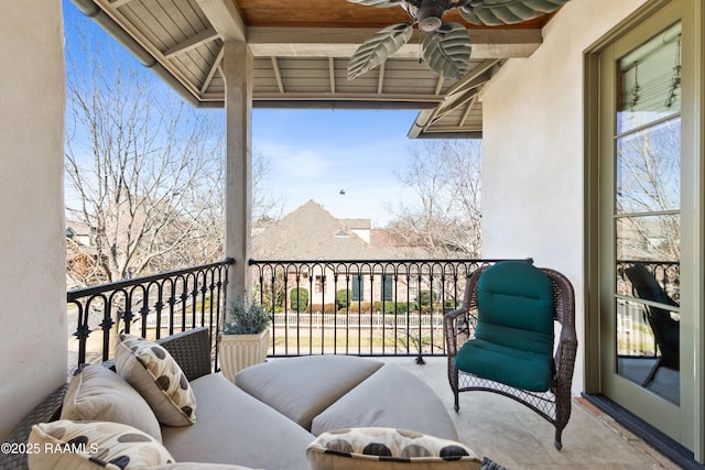 balcony with ceiling fan and a sunroom