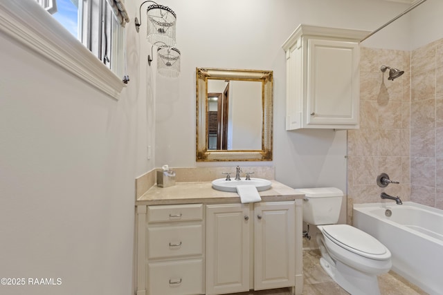 full bathroom with shower / bath combination, vanity, and toilet