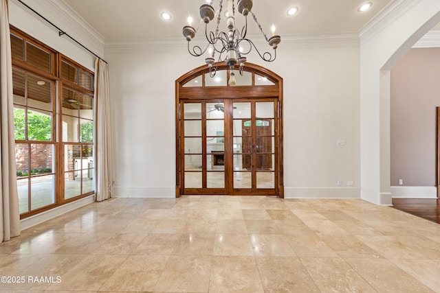 221 Worth Ave, Lafayette, LA 70508 - unfurnished dining area featuring arched walkways, ornamental molding, a chandelier, and baseboards