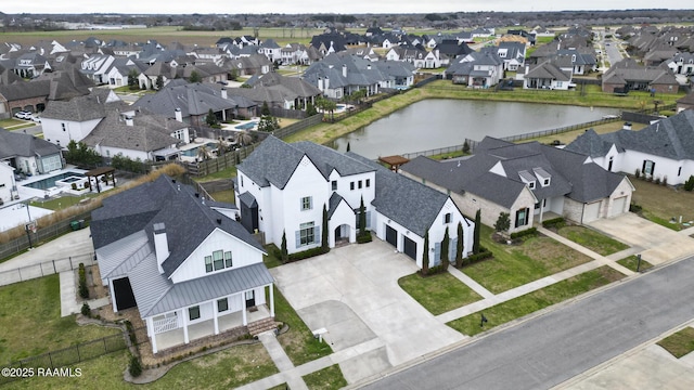 aerial view featuring a water view and a residential view