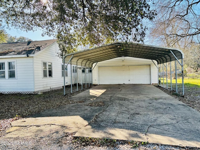 view of side of property with a detached garage