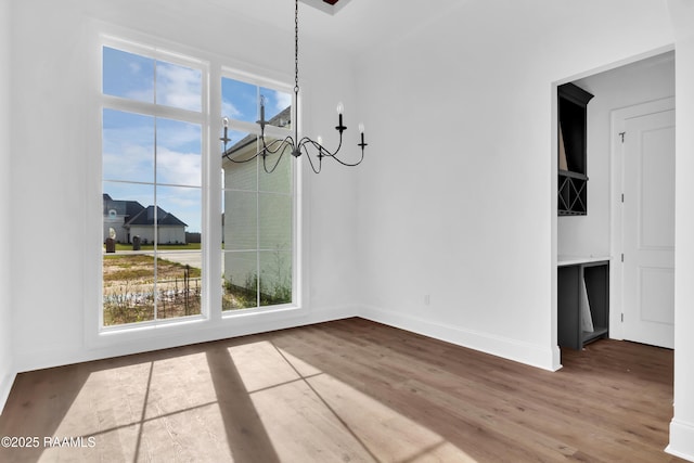 134 Cypress Bend Rd, Scott, LA 70583 - unfurnished dining area featuring a chandelier and wood finished floors