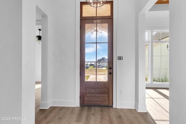 134 Cypress Bend Rd, Scott, LA 70583 - entryway with a chandelier, wood finished floors, and plenty of natural light