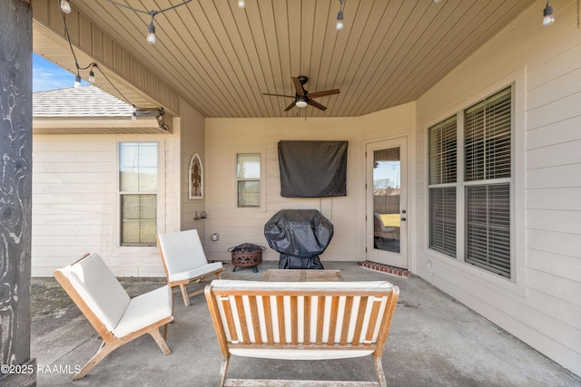 view of patio / terrace featuring an outdoor fire pit, ceiling fan, and area for grilling