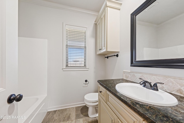 full bath featuring ornamental molding, a tub to relax in, vanity, and toilet