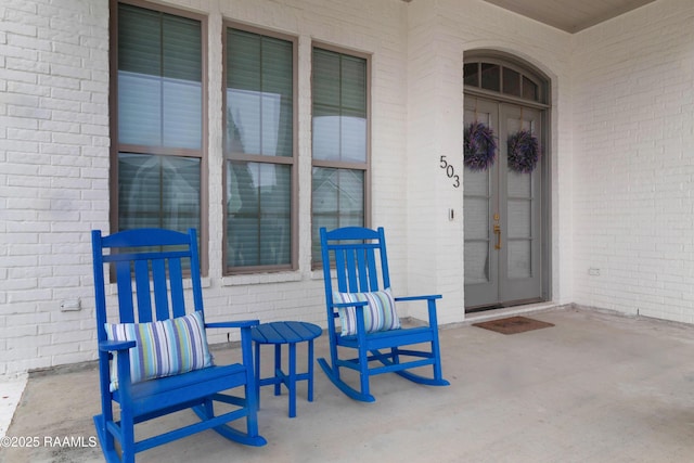 entrance to property with brick siding