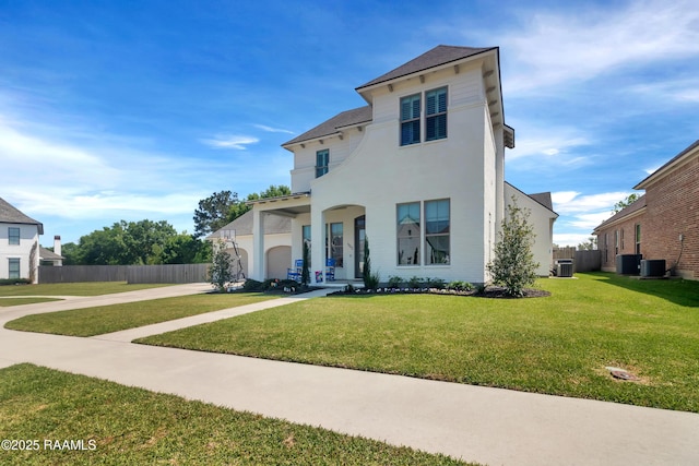 mediterranean / spanish house featuring stucco siding, central air condition unit, a front lawn, and fence