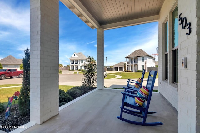 view of patio / terrace featuring a residential view and a porch