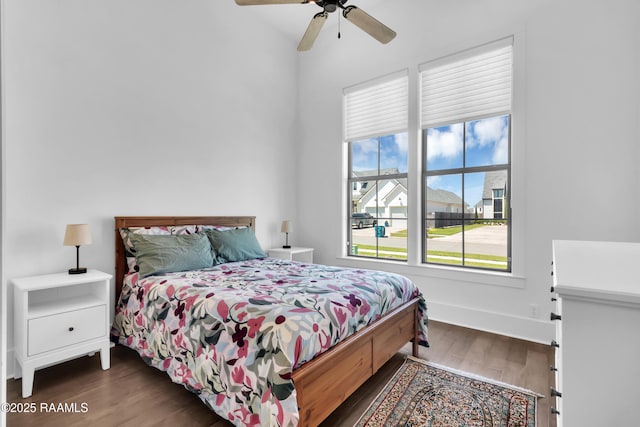 bedroom with a ceiling fan and wood finished floors