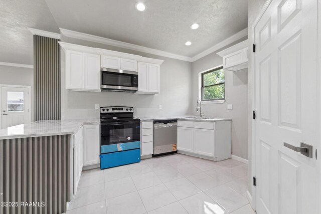 kitchen with crown molding, a sink, stainless steel appliances, white cabinets, and recessed lighting