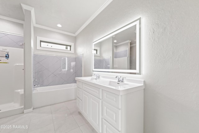 bathroom with a textured wall, crown molding, a walk in shower, and a sink