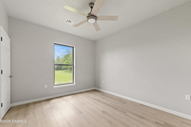 unfurnished bedroom with baseboards, a ceiling fan, visible vents, and light wood-style floors