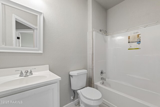 full bathroom with shower / bathing tub combination, baseboards, vanity, and toilet