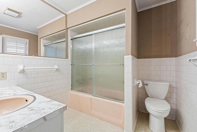full bath with visible vents, toilet, ornamental molding, tile walls, and vanity