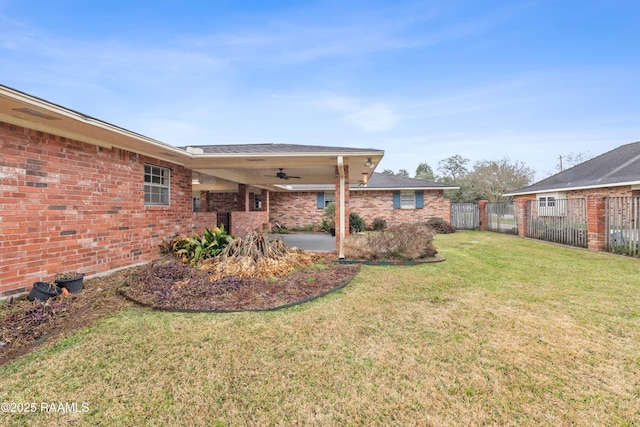 view of yard featuring a patio area, a ceiling fan, and fence