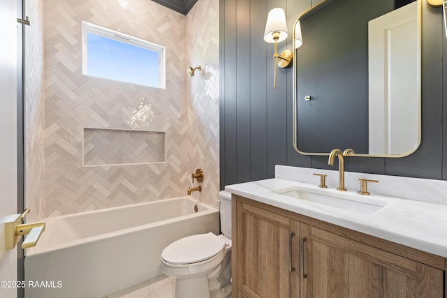 bathroom with toilet,  shower combination, and vanity