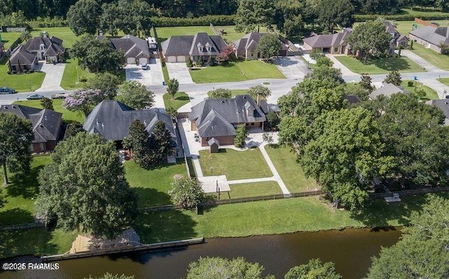 drone / aerial view with a residential view and a water view