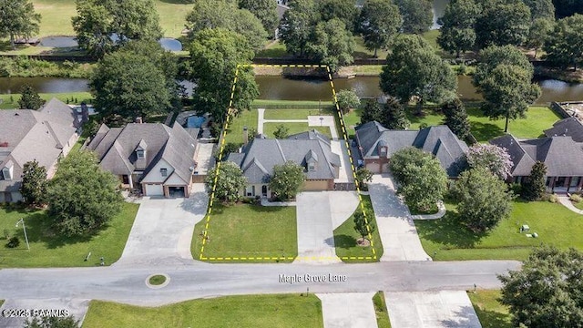 bird's eye view with a residential view and a water view