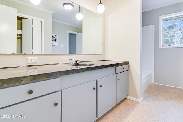 full bath with ornamental molding, vanity, baseboards, and a bath