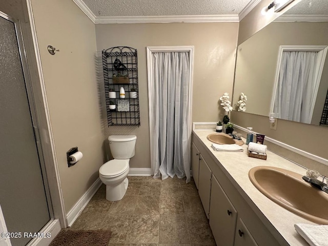 full bathroom featuring a shower stall, a textured ceiling, and a sink